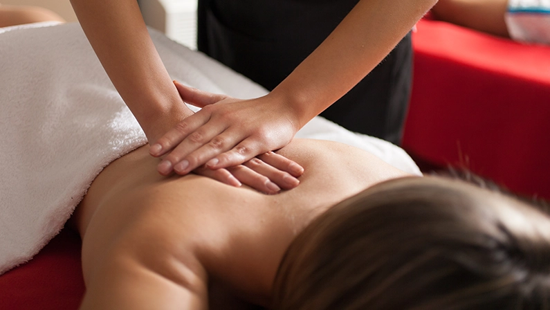 Woman having a swedish massage in a spa