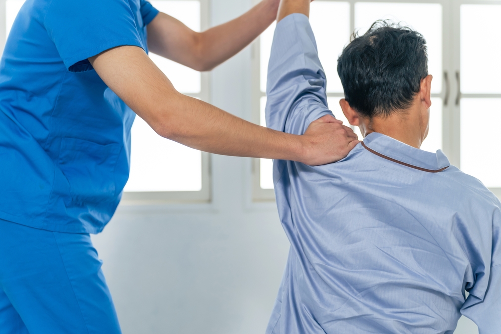 A physiotherapist who performs rehabilitation. Massage.