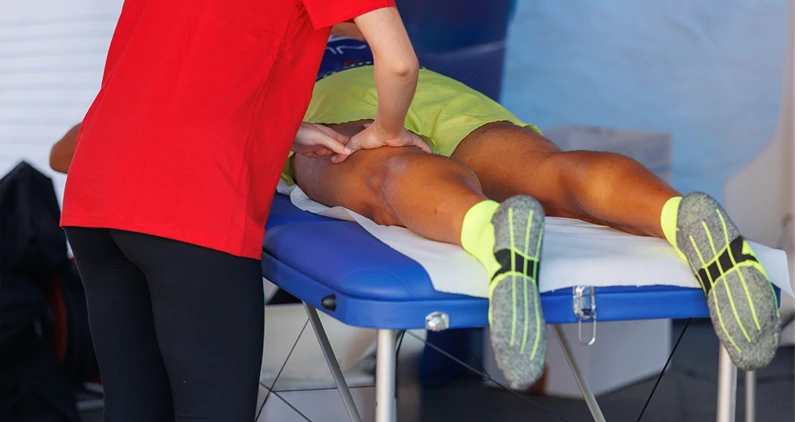 Athlete's Legs Professional Massage Treatment after Sport Workout: Fitness and Wellness.